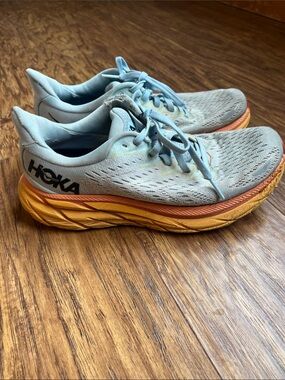 Hoka Women's Light Blue Running Shoes with Orange and Yellow Midsole